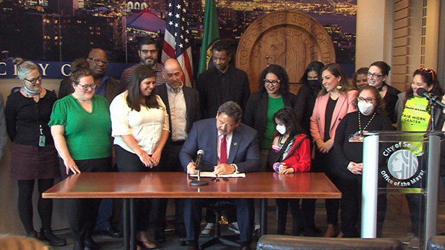Mayor signs paid sick & safe time bill for app-based workers on Explore Videos Page Mayor signs paid sick & safe time bill for app-based workers